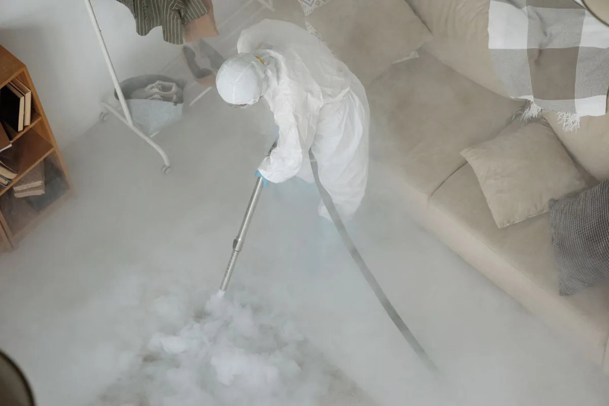 Biohazard cleanup technician in protective equipment, Hingham, MA